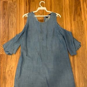 a denim dress with shoulder cut outs